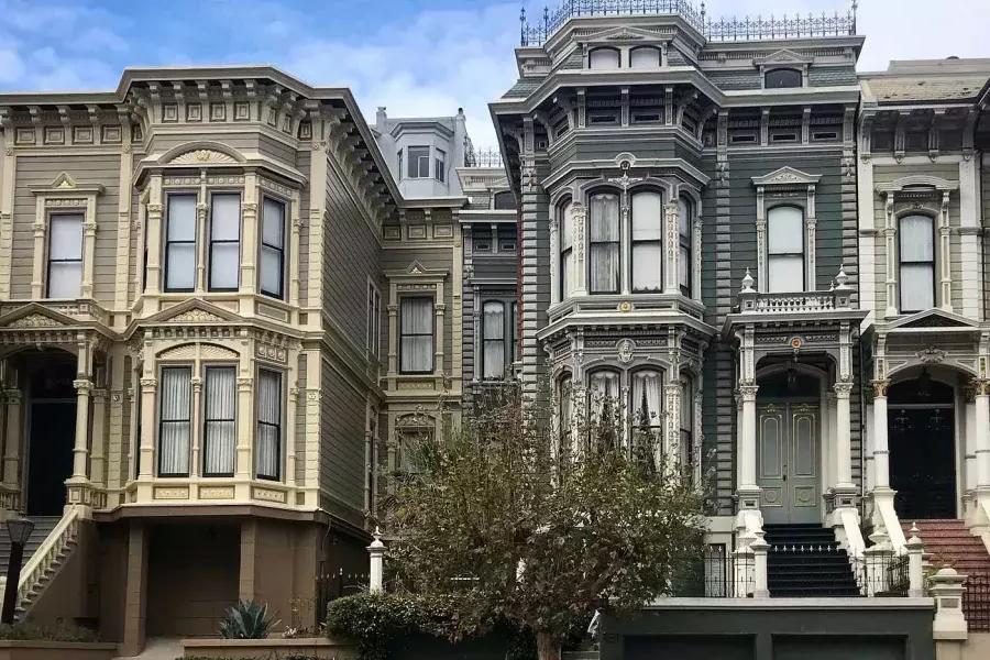 A row of ornate Victorian houses on a street in Pacific Heights. San Francisco, California.